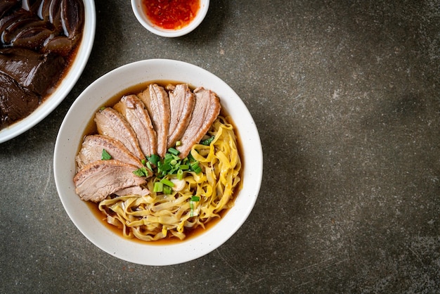 Egg noodles with stewed duck in brown soup