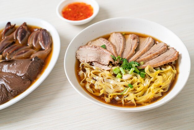 Egg noodles with stewed duck in brown soup