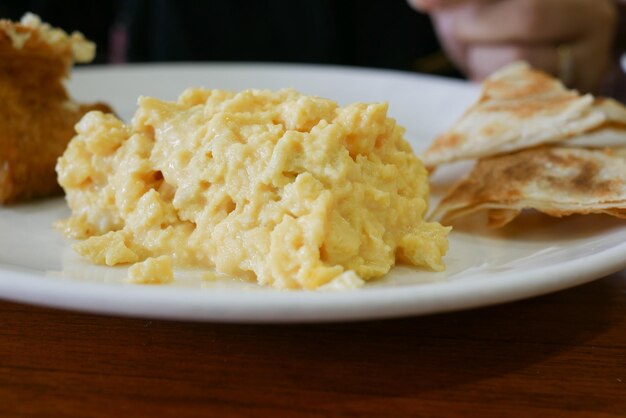 Egg omelet and bread on breakfast table