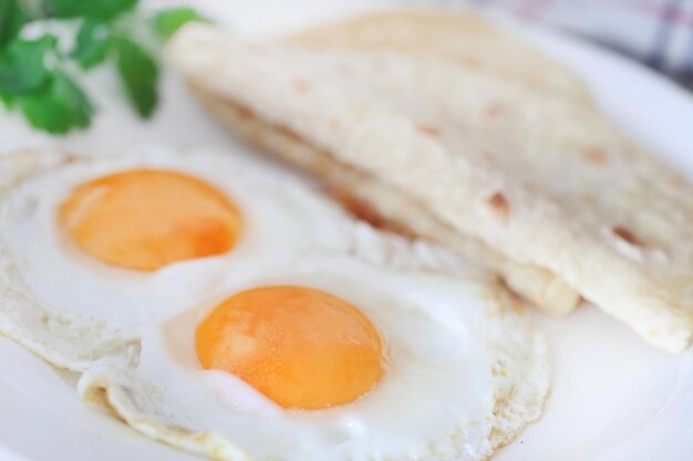 Egg omelet with tortilla bread in a plate as healthy breakfast