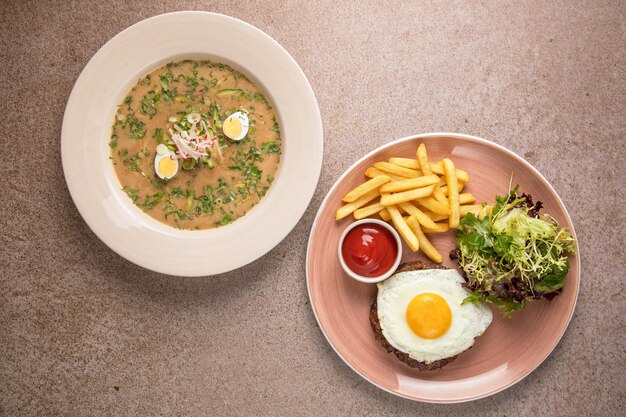 Egg recipe and vegetables salad on a wooden background Avocado toast with eggs