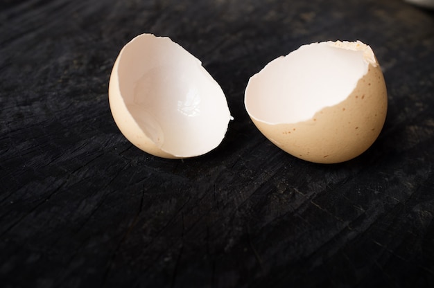 Egg shell on dark wooden table