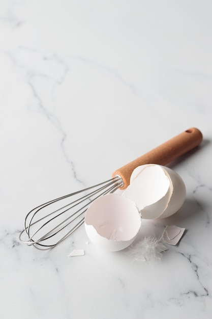 Egg shells with a whisk