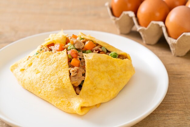 egg wrap or stuffed egg with minced pork, carrot, tomato and green pea