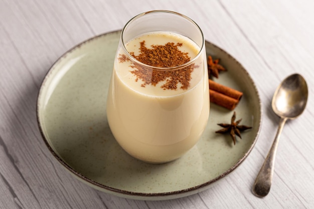 Eggnog cup with cinnamon powder