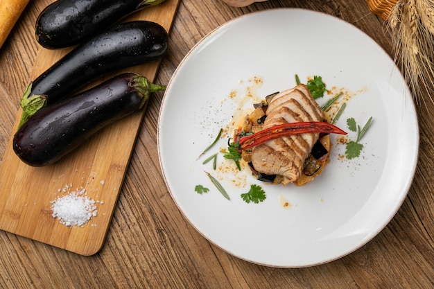 Eggplant dish in a restaurant on a wooden table