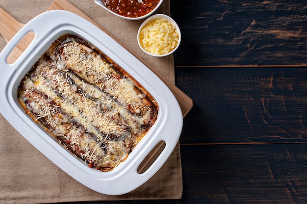 Eggplant parmigiana with cheese and tomato sauce.