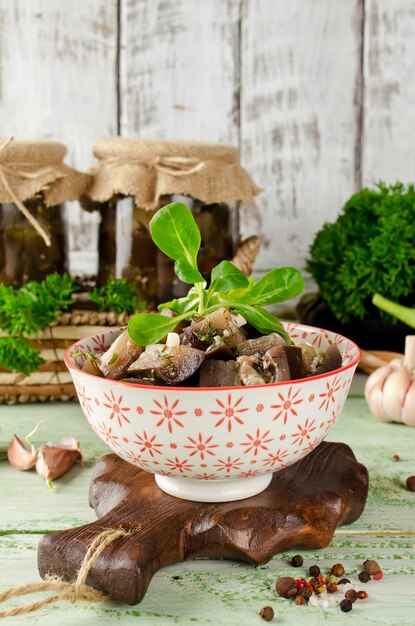 Eggplant preserve in glass jar on a wooden table