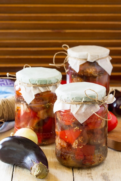 Eggplant salad with vegetables in jars