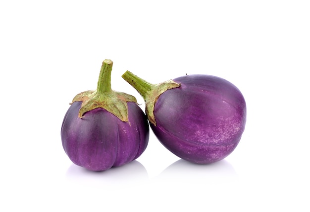 Eggplant on white wall