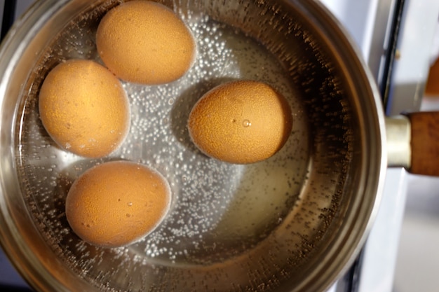 Eggs are boiled in pan