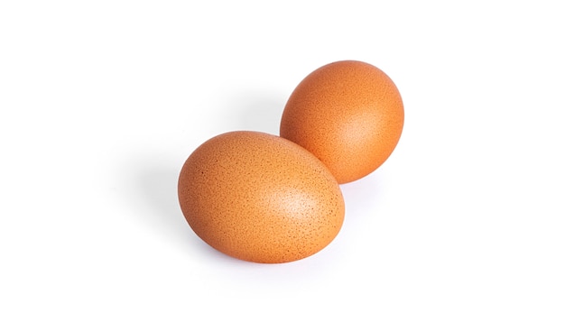 Eggs are isolated on a white background. Brown eggs. High quality photo