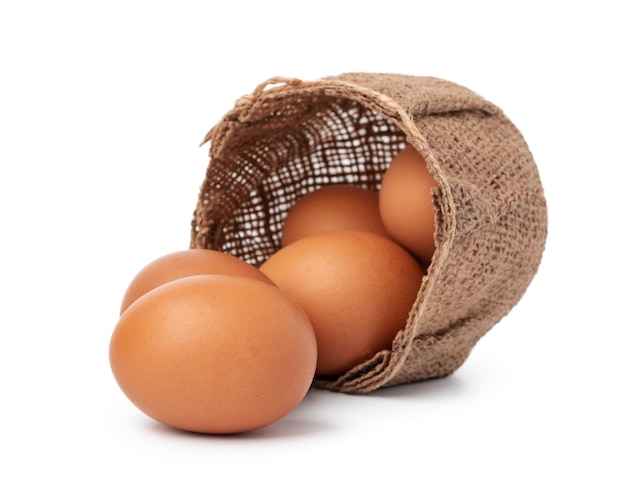 Eggs in basket isolated on white background