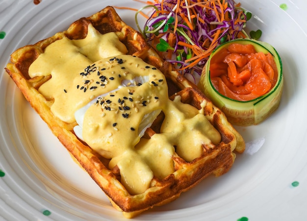 Eggs Benedict poached eggs on belgian waffles with salted salmon