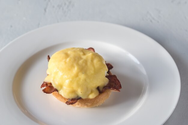 Eggs Benedict on the white plate