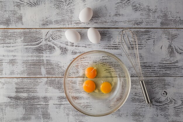 Eggs in a bowl with whisk