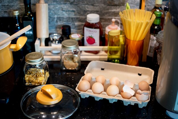 Eggs and cooking objects on kitchen top