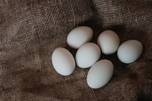 Eggs on a dark background White eggs Easter day