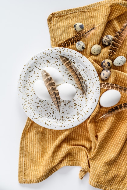 Eggs and feathers on dotted plate