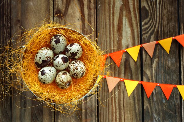 Eggs in a nest  on a wooden table