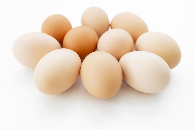 eggs out of egg tray isolated on white background Eggs protected in brown recycle paper tray at eas