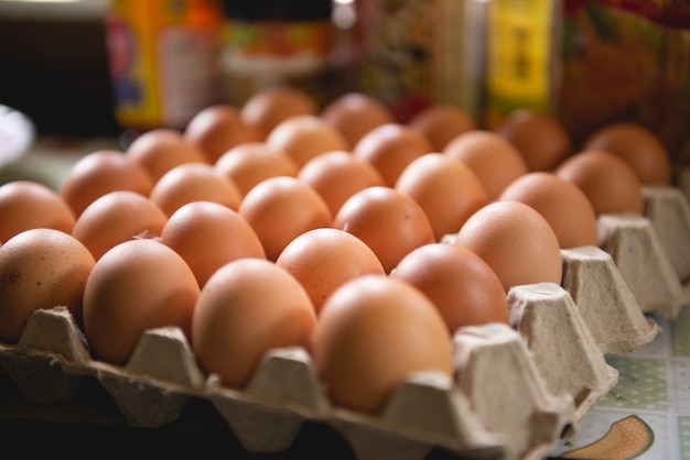 Photo eggs in a paper tray are prepared for easy cooking.