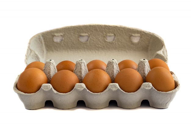 Eggs in paper tray isolated on white 