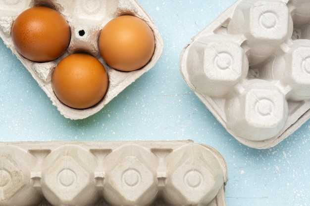 Eggs,salat and pasta in eco package on white cement\
background.zero waste cconcept. package-free food shopping. top\
view.place for text