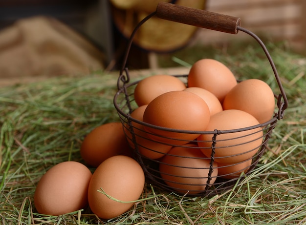 Eggs in wicker basket on table close-up