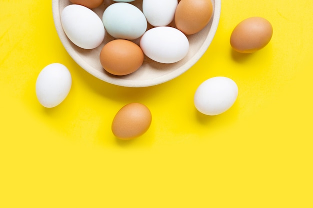 Eggs on yellow background. 