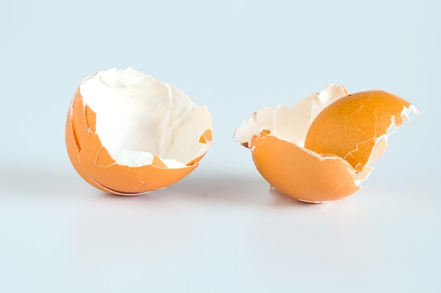 Eggshell scattered from egg boiled on a white background.