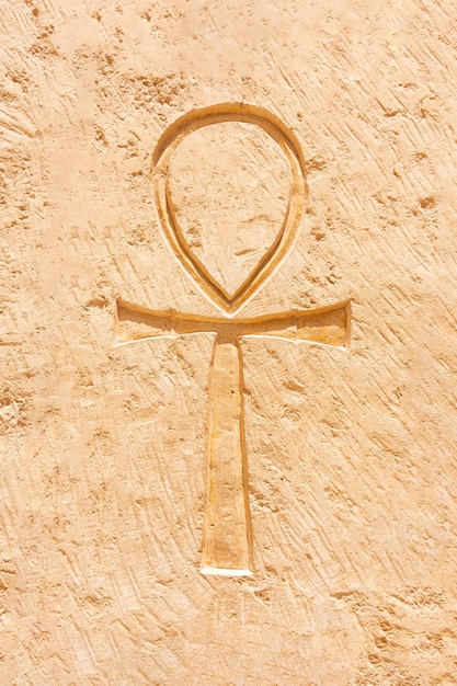 An egyptian cross engraved on a stone