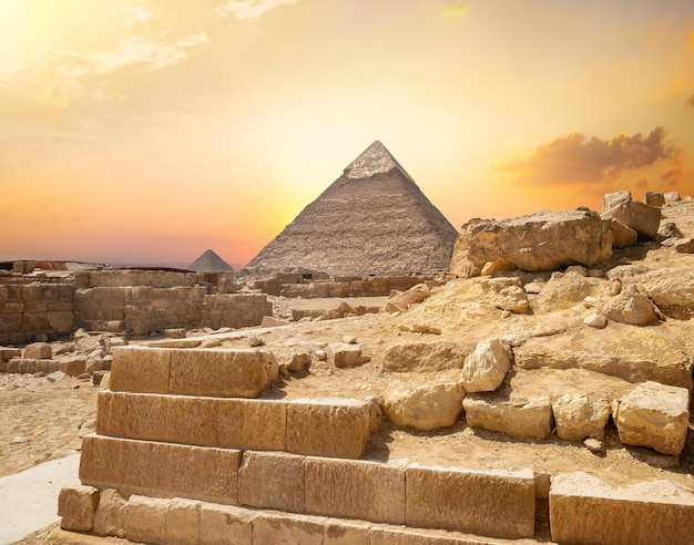 Egyptian pyramid in sand desert and clear sky