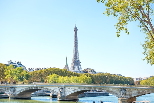 Eiffel tower and bridge on Seine in Paris, France