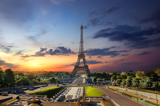 Eiffel Tower and fountains near it at dawn in Paris, France