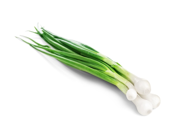 Eight ripe, beautiful spring onions on a white background.