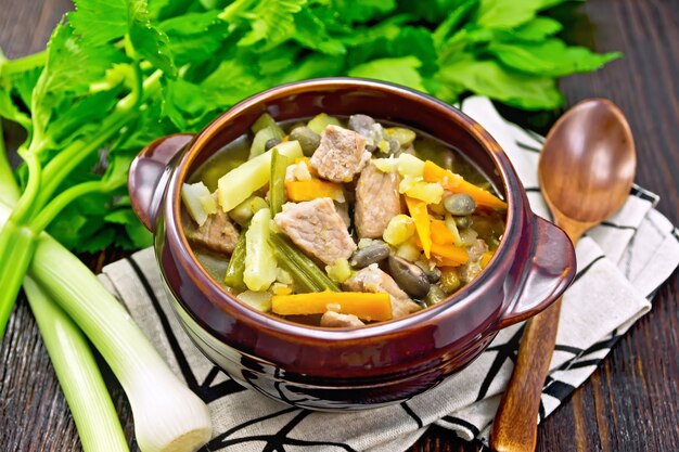 Photo eintopf soup made from pork, celery, beans, carrots and potatoes