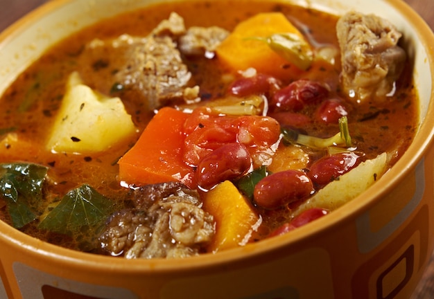 Photo eintopf -traditional german cuisine dish.closeup of a bowl of beef stew.farm-style