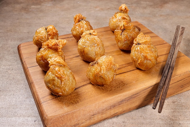 ekado or ekkado is processed fish or shrimp meat wrapped in dumpling skin and shaped like a bag