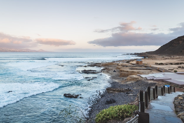 El confital beach at sunrise in Gran Canaria, Canary islands, Spain. Coast volcanic landscape. 