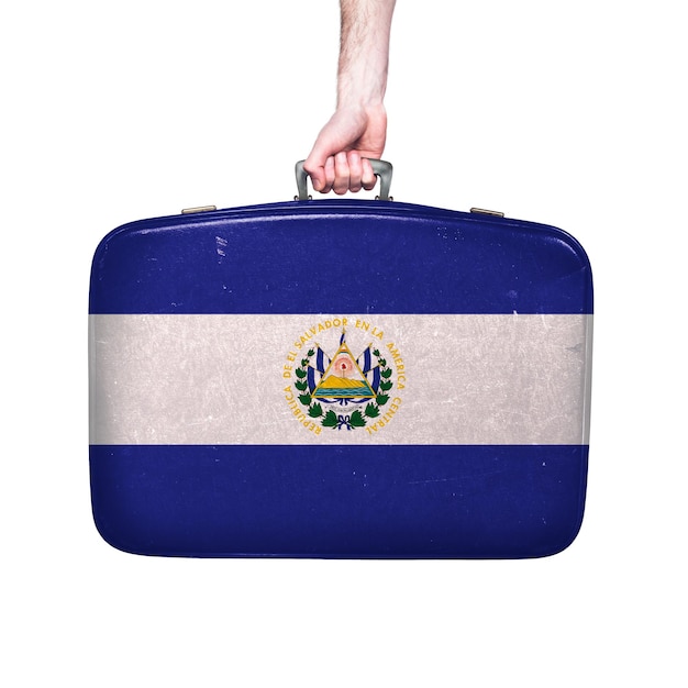 El Salvador flag on a vintage leather suitcase