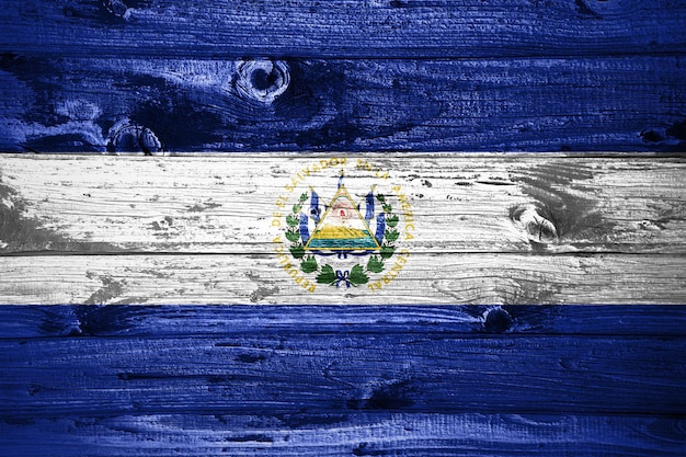 El Salvador flag on wooden planks background wood flag