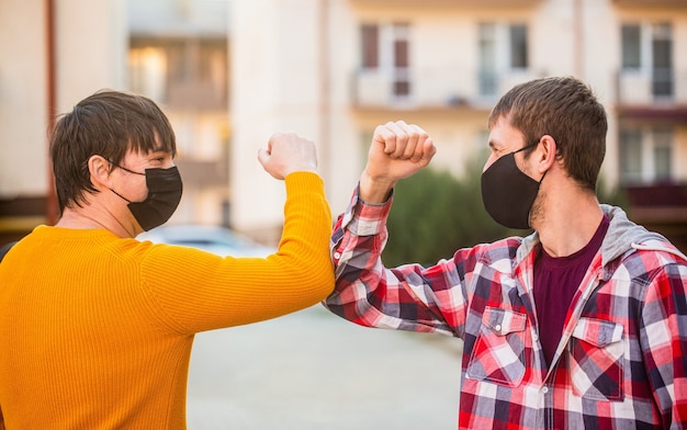 Elbows bump Fight coronavirus bump elbows outdoors