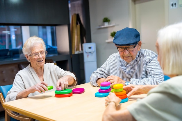 Elder people playing skill games together in a nursing home