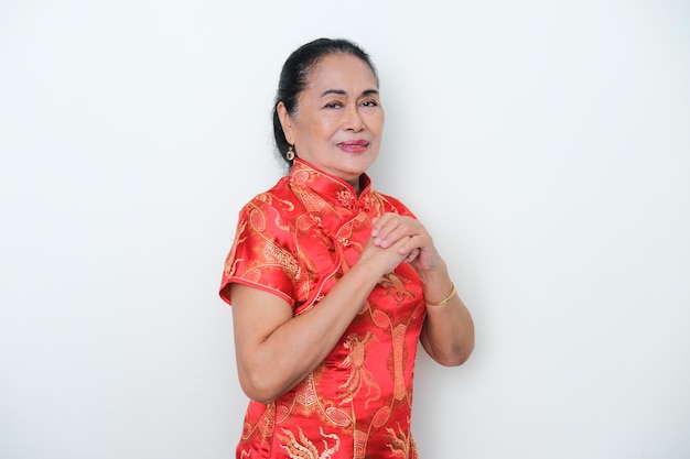 Elderly Asian woman wearing Chinese costume to celebrate lunar new year