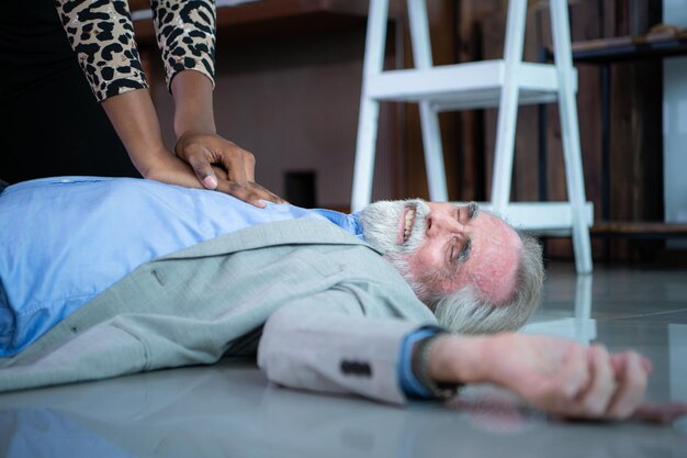 an elderly businessman suffered a sudden heart failure at work a coworker was administering cpr