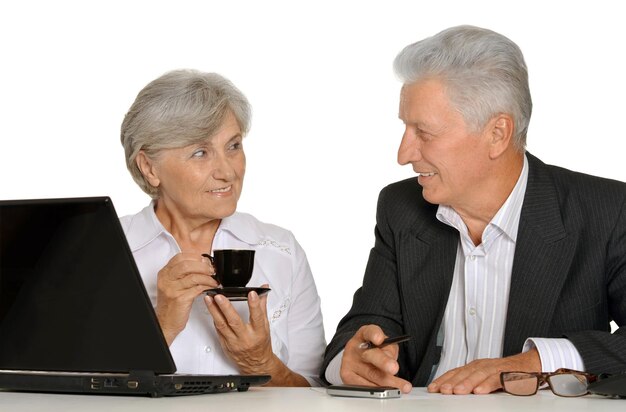 Elderly businessman with laptop