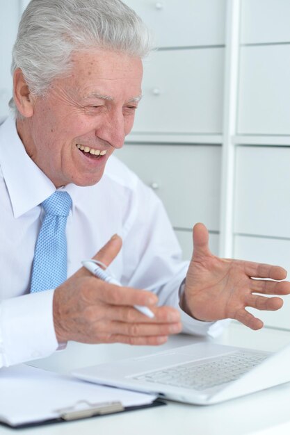 Elderly businessman working in the office