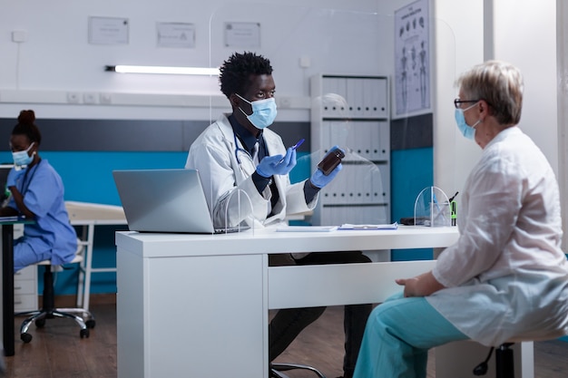 Elderly caucasian patient getting bottle of medicine