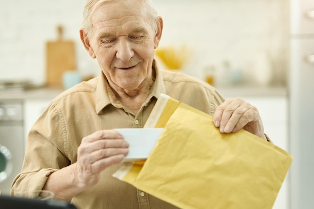 Elderly citizen unpacking his medicine mail order